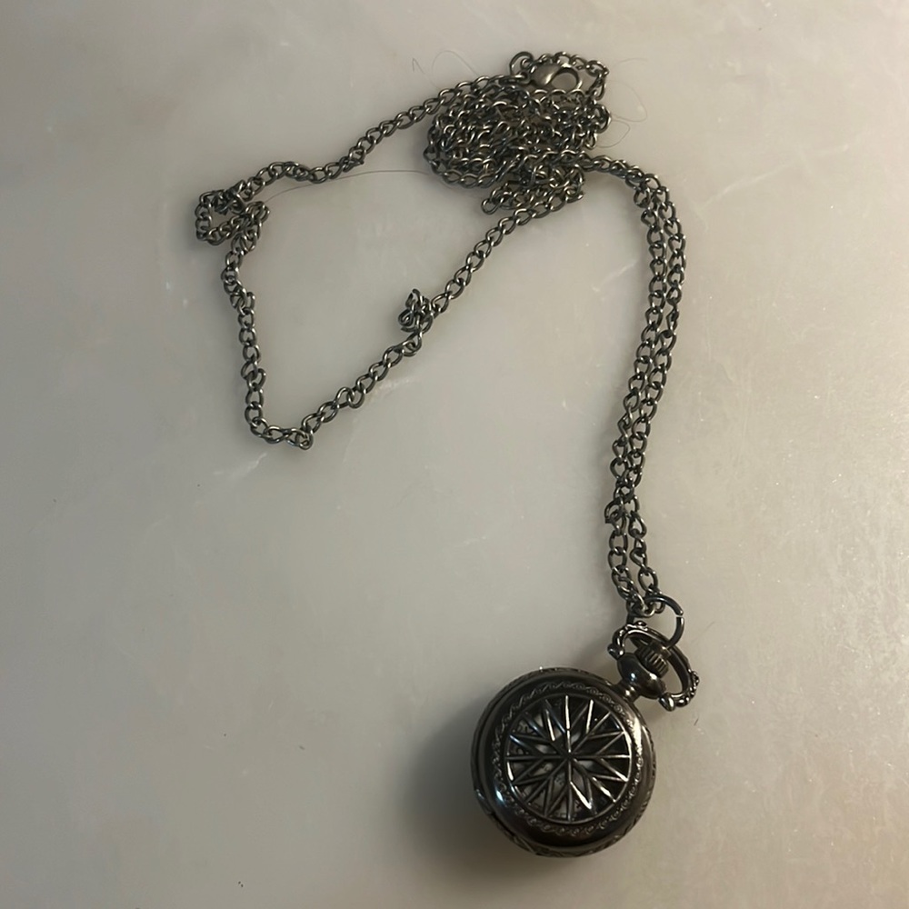 Long fake clock charm necklace